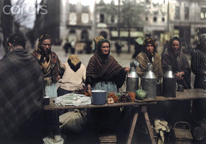 ca. October 7, 1930, Krakow, Poland --- Women sell milk and vegetables at a market --- Image by © Hans Hildenbrand/National Geographic Society/Corbis